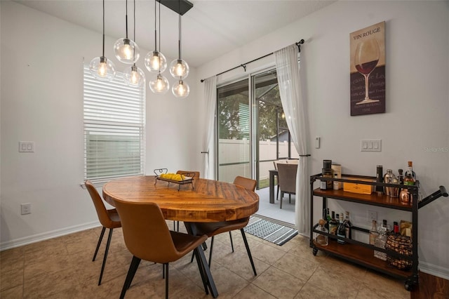 dining space featuring light tile patterned flooring