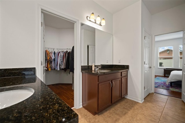 bathroom with tile patterned floors and vanity