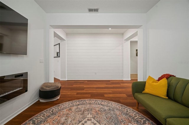 living room with dark wood-type flooring