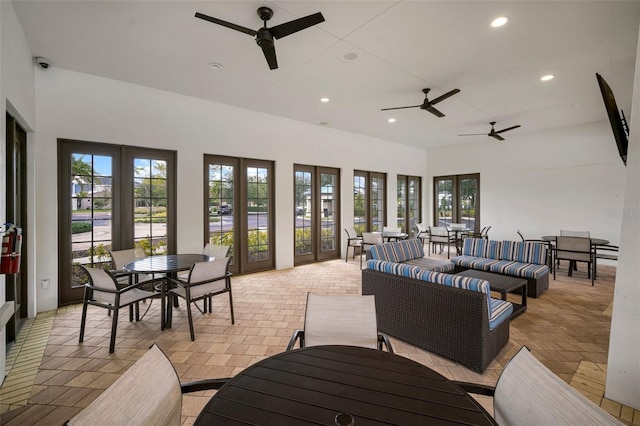 interior space with ceiling fan