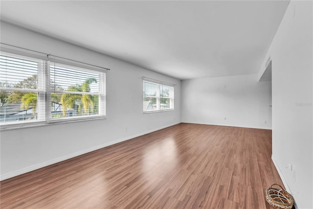 spare room featuring hardwood / wood-style floors