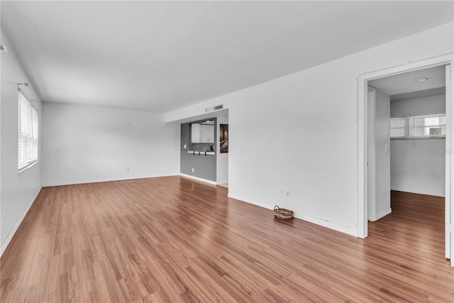 unfurnished living room with light hardwood / wood-style floors