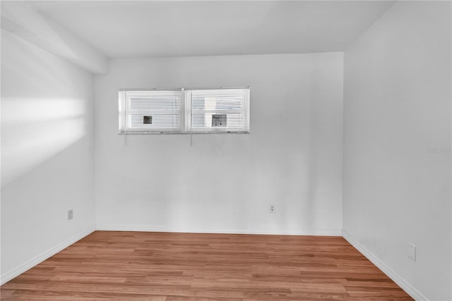 spare room featuring light hardwood / wood-style flooring