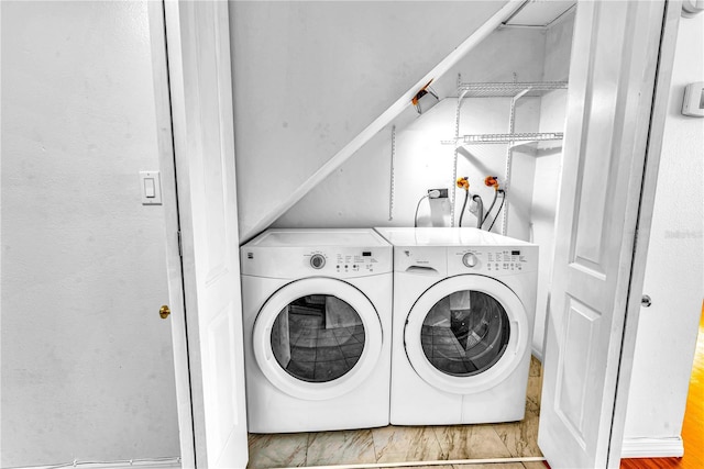 clothes washing area with washer and dryer