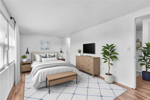 bedroom featuring light wood-type flooring