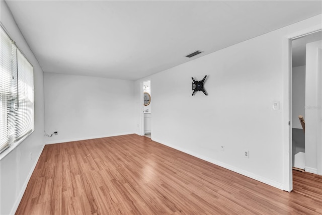 spare room featuring light hardwood / wood-style flooring