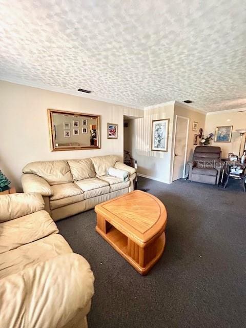 living room with ornamental molding, dark carpet, and a textured ceiling