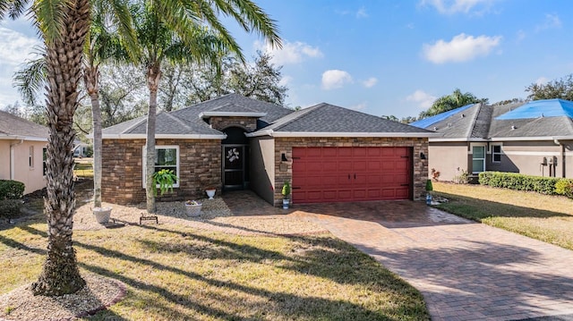 single story home with a garage and a front yard