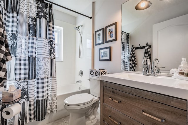 full bathroom with tile patterned floors, toilet, shower / bath combo with shower curtain, and vanity