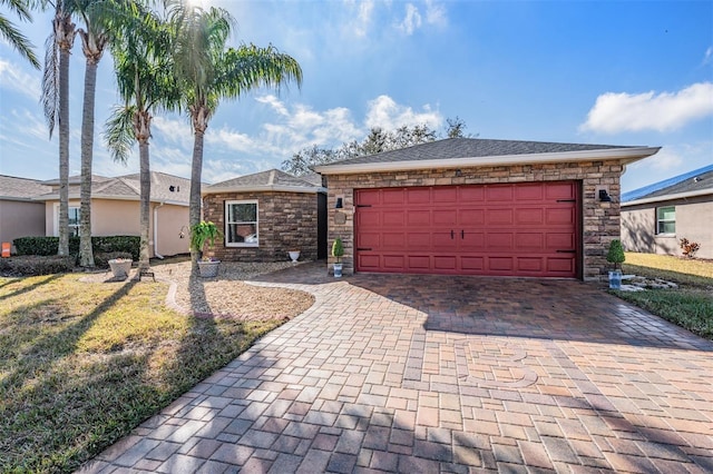 ranch-style home featuring a garage