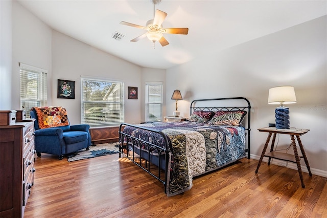 bedroom with hardwood / wood-style flooring, lofted ceiling, and ceiling fan