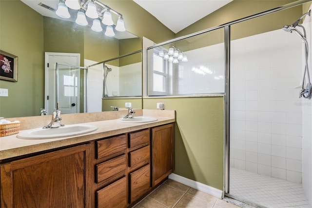 bathroom featuring vanity, lofted ceiling, tile patterned floors, and a shower with shower door