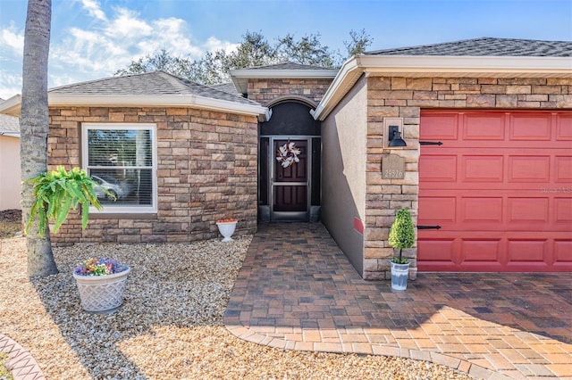 entrance to property featuring a garage