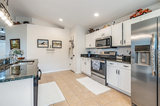 kitchen with stainless steel appliances, sink, and white cabinets