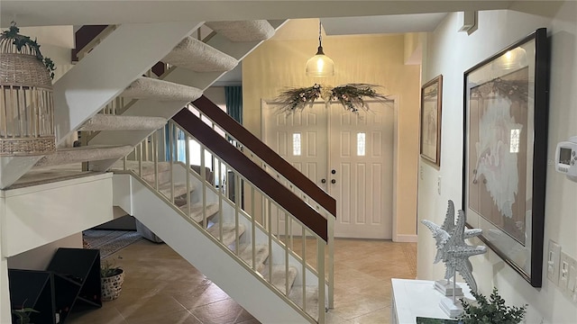 staircase with tile patterned floors