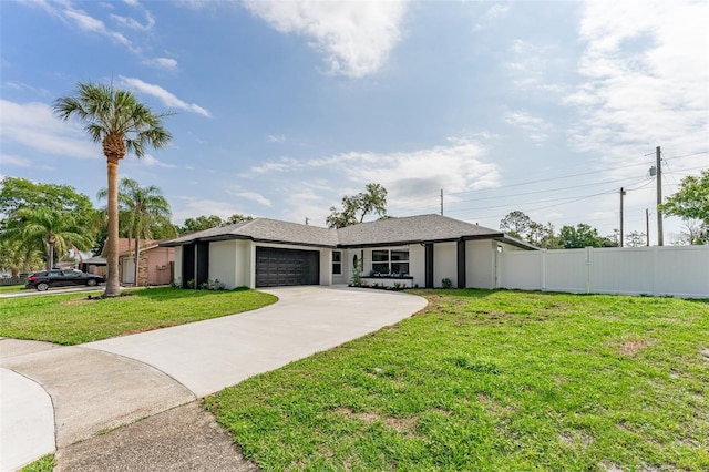 ranch-style home with a garage and a front lawn