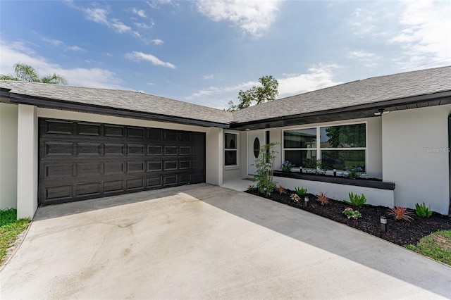 ranch-style home featuring a garage