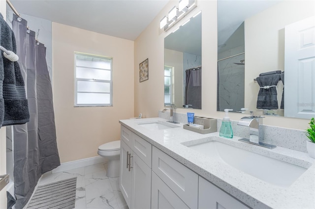 bathroom with vanity, toilet, and a shower with shower curtain