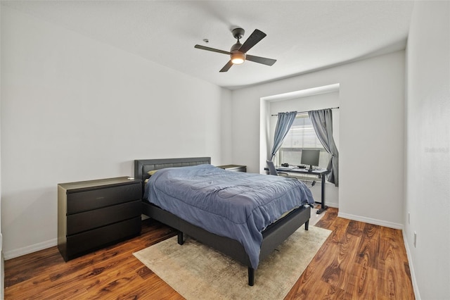 bedroom featuring dark hardwood / wood-style floors and ceiling fan