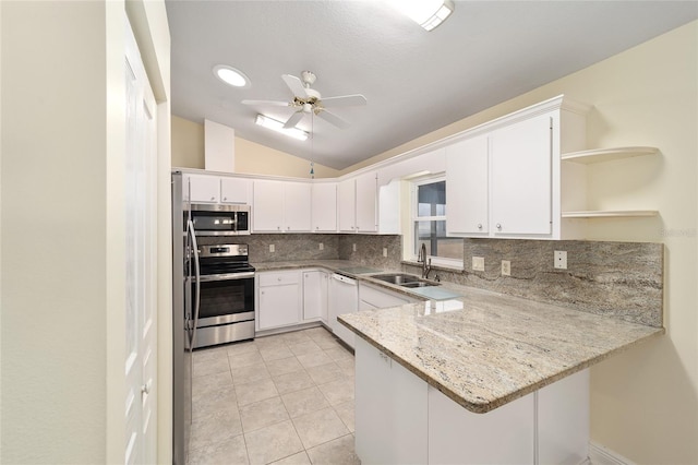 kitchen with white cabinetry, sink, light stone counters, kitchen peninsula, and stainless steel appliances