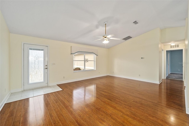 unfurnished living room featuring wood-type flooring, lofted ceiling, and ceiling fan