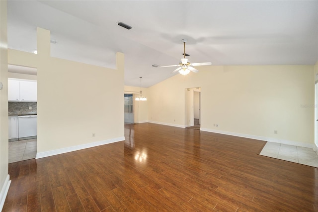 unfurnished living room featuring vaulted ceiling, dark wood-type flooring, and ceiling fan with notable chandelier