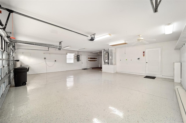 garage featuring a garage door opener and electric panel