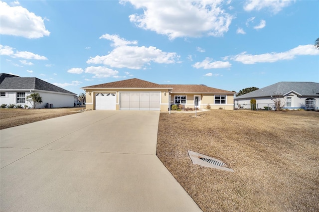 ranch-style home with a garage and a front yard