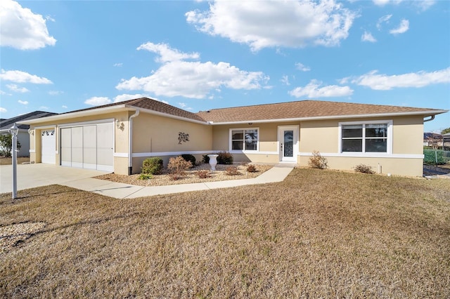 ranch-style house featuring a garage and a front yard