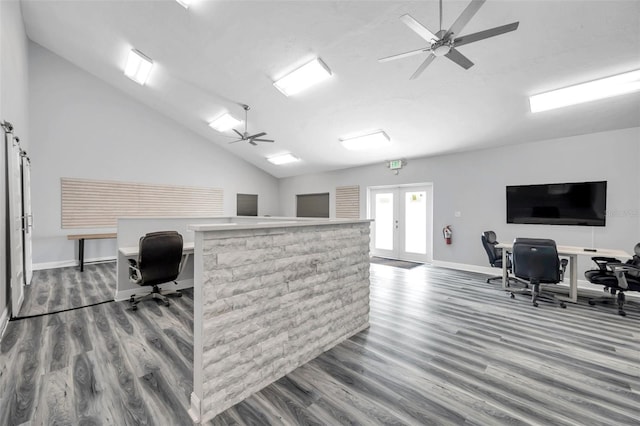 office featuring french doors, ceiling fan, vaulted ceiling, and hardwood / wood-style flooring