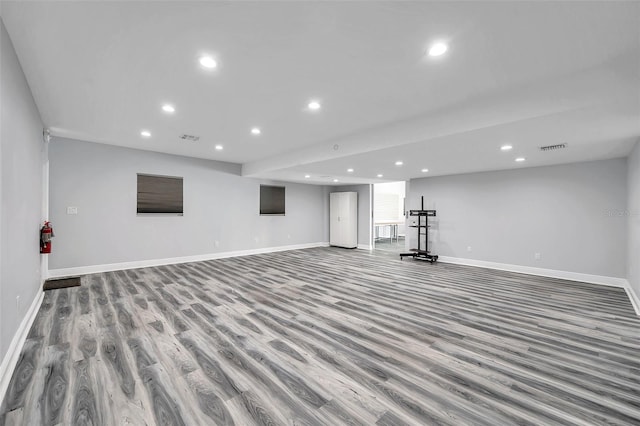 basement featuring light hardwood / wood-style flooring