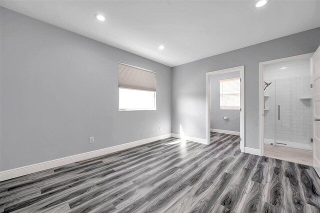 empty room with hardwood / wood-style flooring