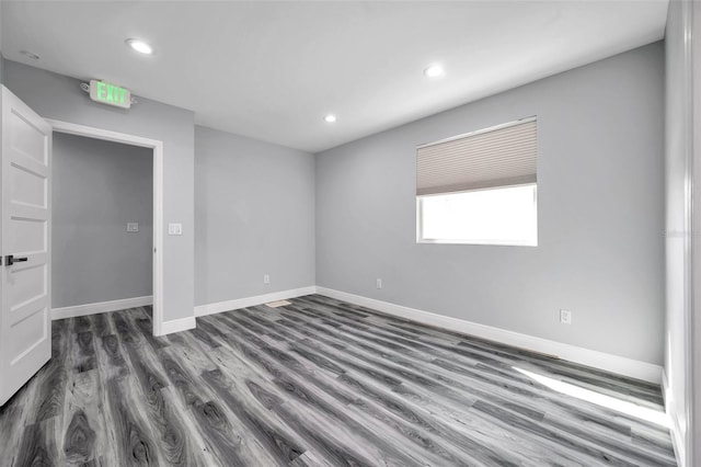 spare room featuring dark hardwood / wood-style floors