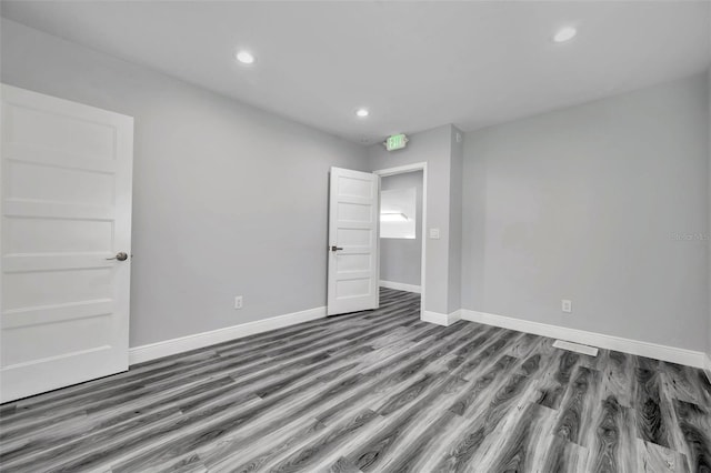 unfurnished bedroom featuring wood-type flooring