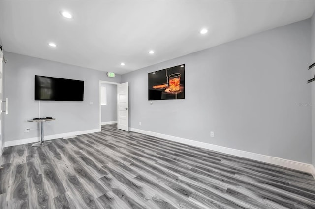 unfurnished living room featuring wood-type flooring