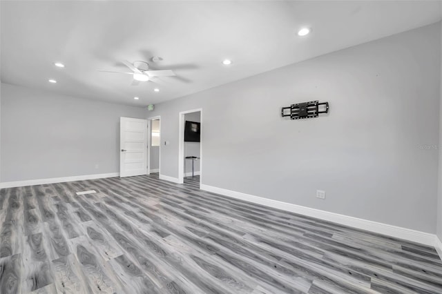 spare room with ceiling fan and light hardwood / wood-style floors