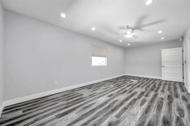 spare room featuring hardwood / wood-style flooring and ceiling fan