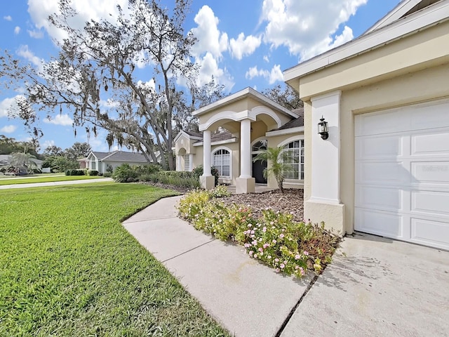 exterior space with a garage and a front yard