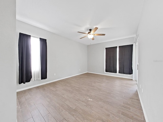 spare room with ceiling fan and light hardwood / wood-style flooring