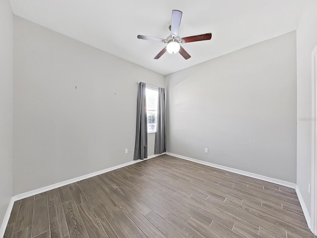 unfurnished room with hardwood / wood-style flooring and ceiling fan
