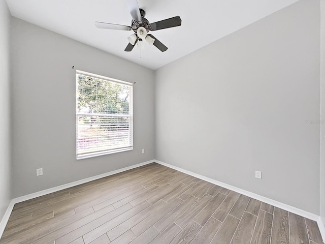 unfurnished room with ceiling fan and light wood-type flooring