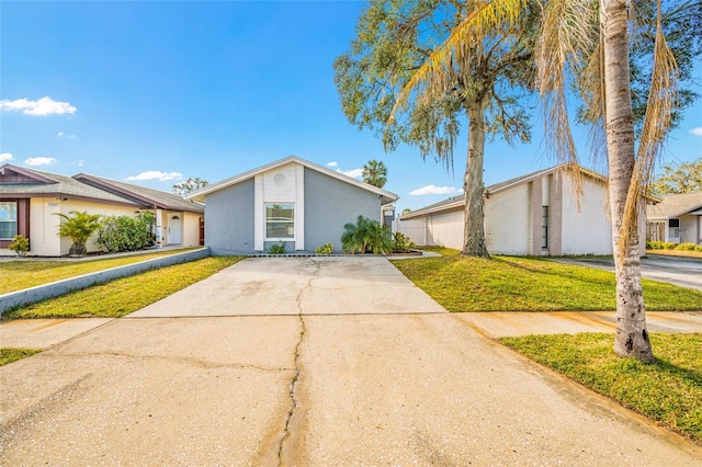 ranch-style house with a front lawn