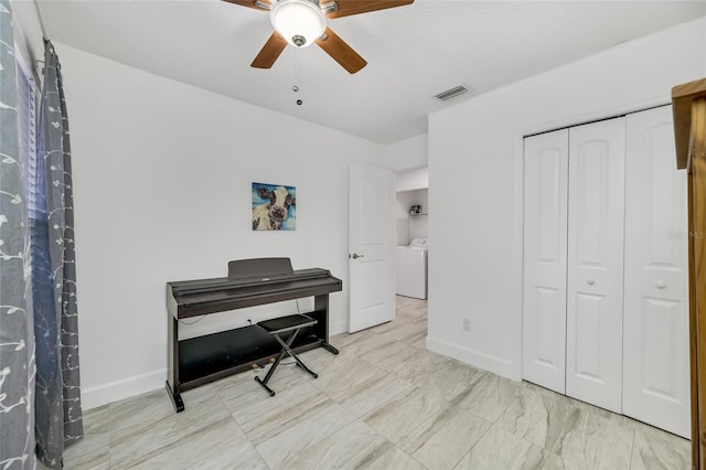 home office with washer / dryer and ceiling fan