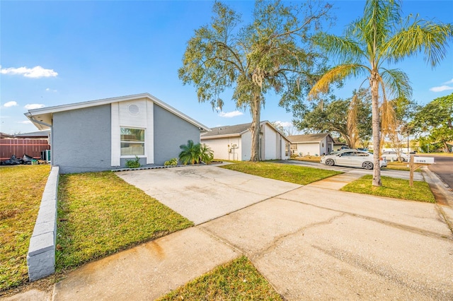 single story home with a front lawn