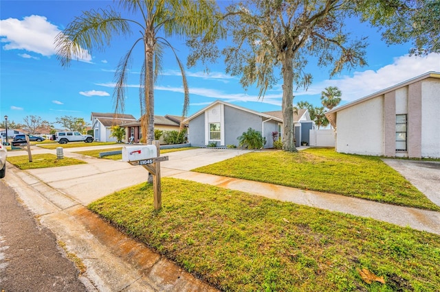 ranch-style house featuring a front lawn