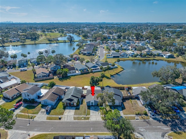 birds eye view of property featuring a water view