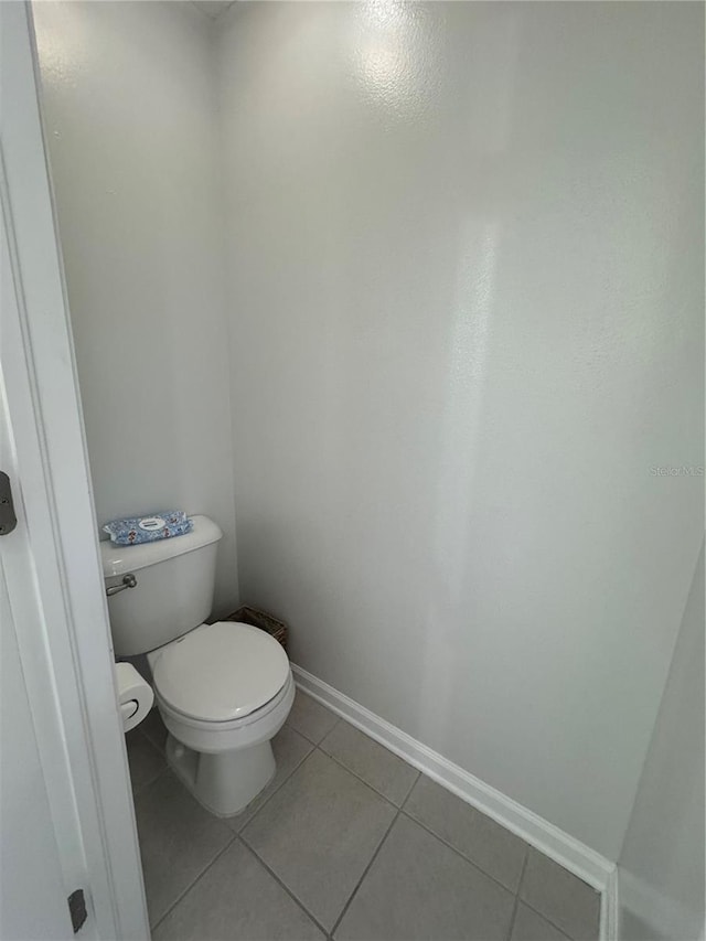 bathroom featuring tile patterned flooring and toilet