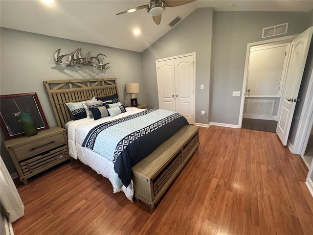 bedroom featuring wood-type flooring, a closet, ceiling fan, and vaulted ceiling