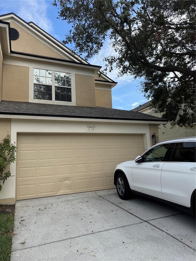 view of side of home with a garage