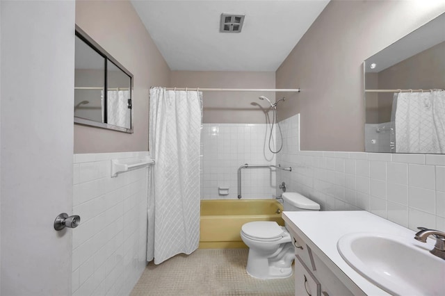 full bathroom featuring vanity, tile walls, tile patterned floors, and toilet